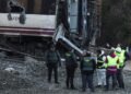 Spain deploys heavy machinery to find missing bodies among train crash wreckage