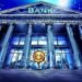 Standard Chartered Said to Launch Crypto Brokerage, Lowers ETH Forecasts