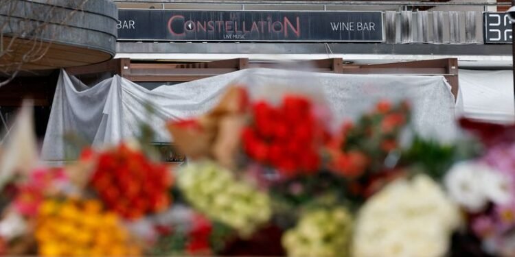 Stunned Swiss Alpine resort seeks solace together after deadly bar fire