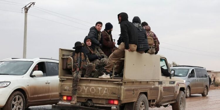 Syrian troops sweep northern towns as Kurdish fighters withdraw