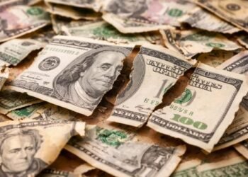 US dollar slides toward steepest weekly drop in seven months on policy uncertainty