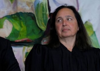 US judge blocks Trump administration’s push to end legal status of 8,400 migrants