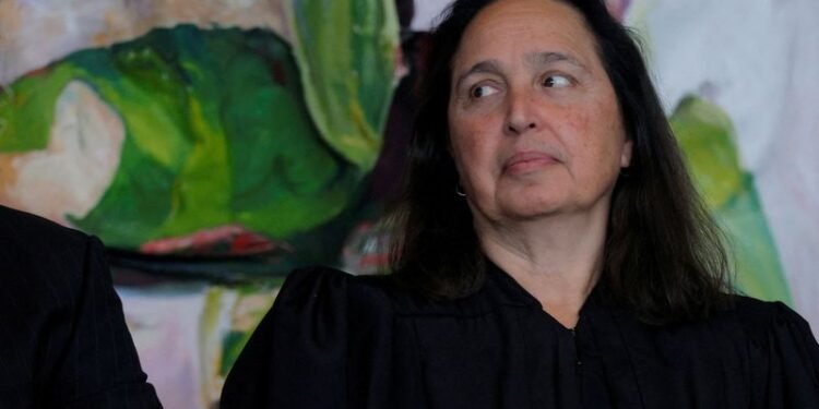 US judge blocks Trump administration’s push to end legal status of 8,400 migrants