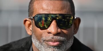 ‘These are college students … not NFL players.’ Deion Sanders’s new $5,000 fines for Colorado players blur the lines around professional sports.