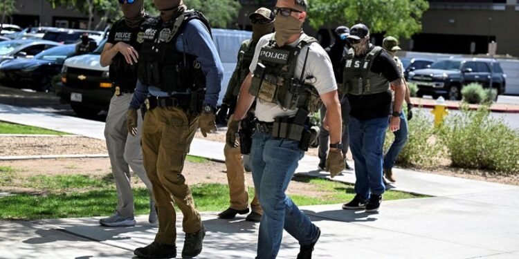 Factbox-Trump’s immigration enforcement record by the numbers