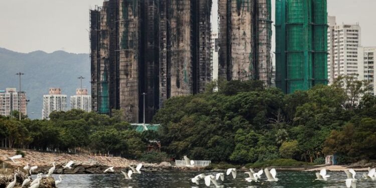 Hong Kong plans to buy homes devastated in deadly high-rise fire