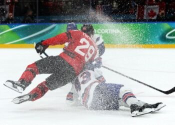 Olympics-Ice hockey-US claim long-awaited gold by beating rivals Canada in overtime thriller
