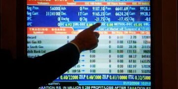 Shares jittery in Asia as metals gyrate, earnings loom