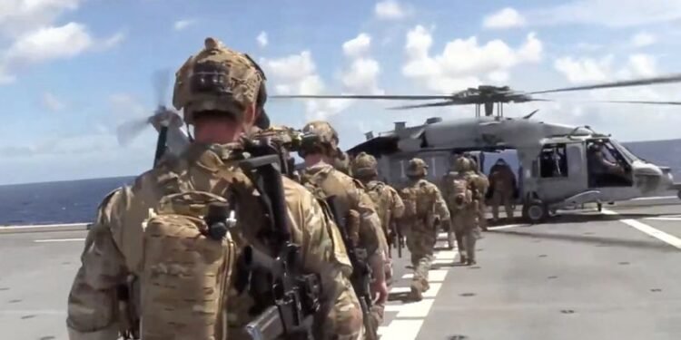 US says it interdicted and boarded vessel defying Trump’s quarantine