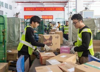 China's factory output and consumption beat forecasts, while property investment contraction slows