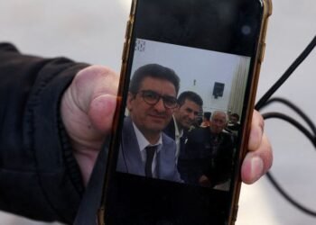 Family of Iranian butcher missing in strike on commercial complex clings to hope