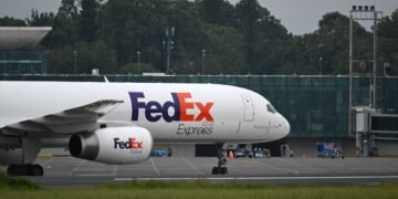 FedEx is getting more upbeat about the year, despite surging fuel costs