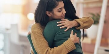 My friend was laid off from our company, but I wasn’t. How should I console her?