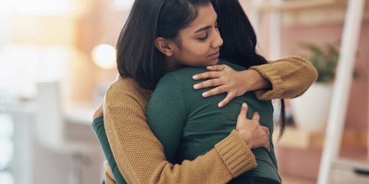 My friend was laid off from our company, but I wasn’t. How should I console her?