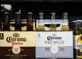 Corona brewer says shoppers are going for cheaper beer and wine, as it grows more cautious on demand
