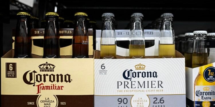Corona brewer says shoppers are going for cheaper beer and wine, as it grows more cautious on demand