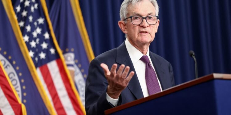 Fed holds rates steady amid dissent