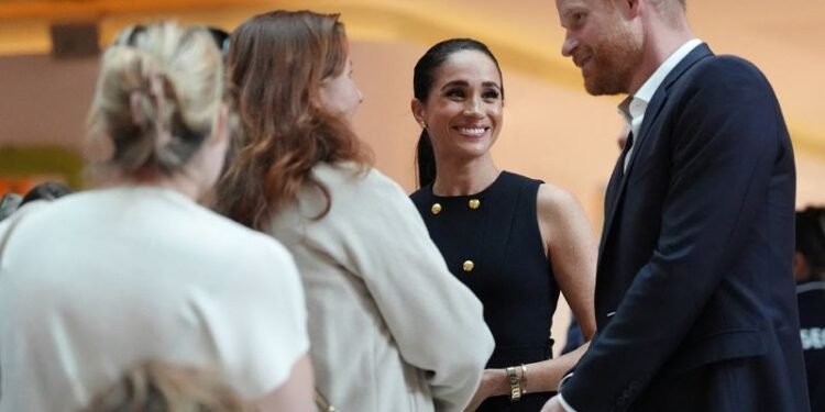 Prince Harry and Meghan arrive in Australia to a muted welcome