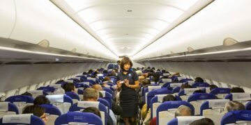 Why Do Flight Attendants Sit on Their Hands?
