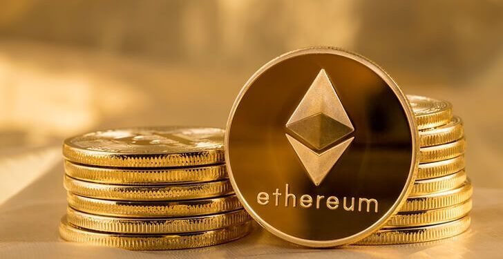Picture of ethereum coins staked together with one coin stood next to them