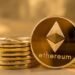 Picture of ethereum coins staked together with one coin stood next to them
