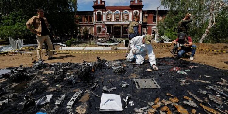 Forensic experts sift through ruined dormitory in Russian-held Luhansk region