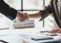 Handshake, Business cooperation at a meeting of business people. Business partners shaking hands in a meeting.