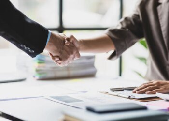 Handshake, Business cooperation at a meeting of business people. Business partners shaking hands in a meeting.