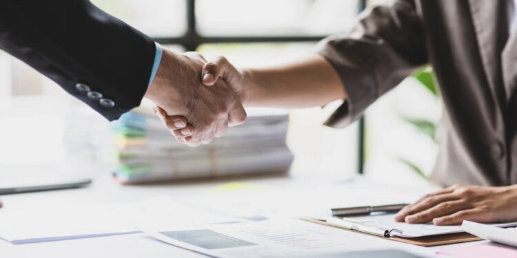 Handshake, Business cooperation at a meeting of business people. Business partners shaking hands in a meeting.