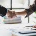 Handshake, Business cooperation at a meeting of business people. Business partners shaking hands in a meeting.