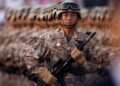 Japan refutes ’new militarism’, accuses China of rapidly arming