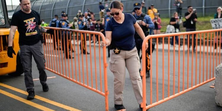 New Jersey state police assert control outside migrant detention center