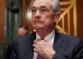 Powell signals cautious Fed stance, lowering rate cut expectations through 2026