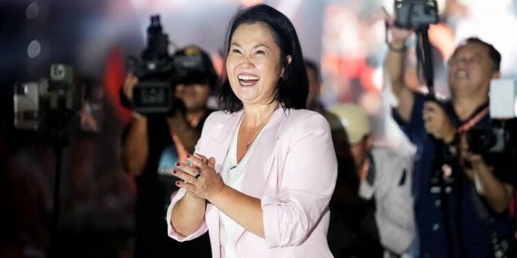 Right-wing Fujimori holds narrow lead one week before Peru presidential runoff, polls show