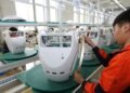 China factory activity returns to expansion riding AI global boom