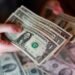 Dollar eases as investors weigh Middle East hopes, rate outlook