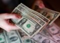 Dollar hits 13-month high as rate-hike bets, stock rout boost demand