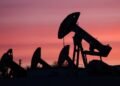 Oil inches down as investors focus on Hormuz flows after peace talks