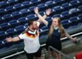 Rain sends Germany and Curacao fans on pre-match hunt for umbrellas and beer