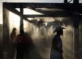 Soccer-Beating the heat no problem for World Cup fans in sweltering Houston