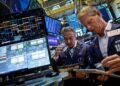 Wall Street ends sharply lower as chips slide, jobs data fuels rate hike fears