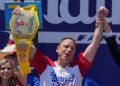 Eating champion Joey Chestnut defends title but blames heat for lower hot-dog tally