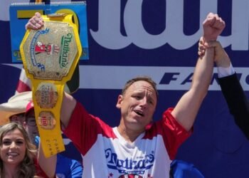 Eating champion Joey Chestnut defends title but blames heat for lower hot-dog tally