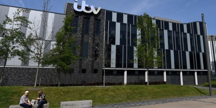 Just a week after spin-off plan, Comcast says it will buy British broadcaster